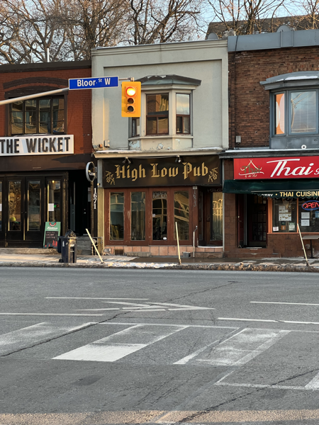 A pub named High Low Pub on the other side of the street.